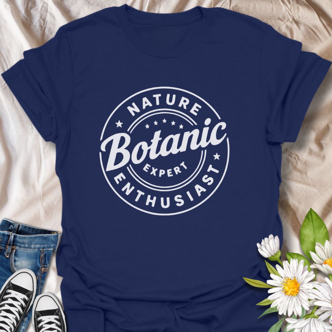Show off your love for plants with this bold graphic t-shirt featuring the phrase "Nature Expert Botanic Enthusiast." This is in either white or black text, dependant on the color choice. This Tee is Perfect for gardeners, plant parents, and anyone passionate about botany, nature, and green living.