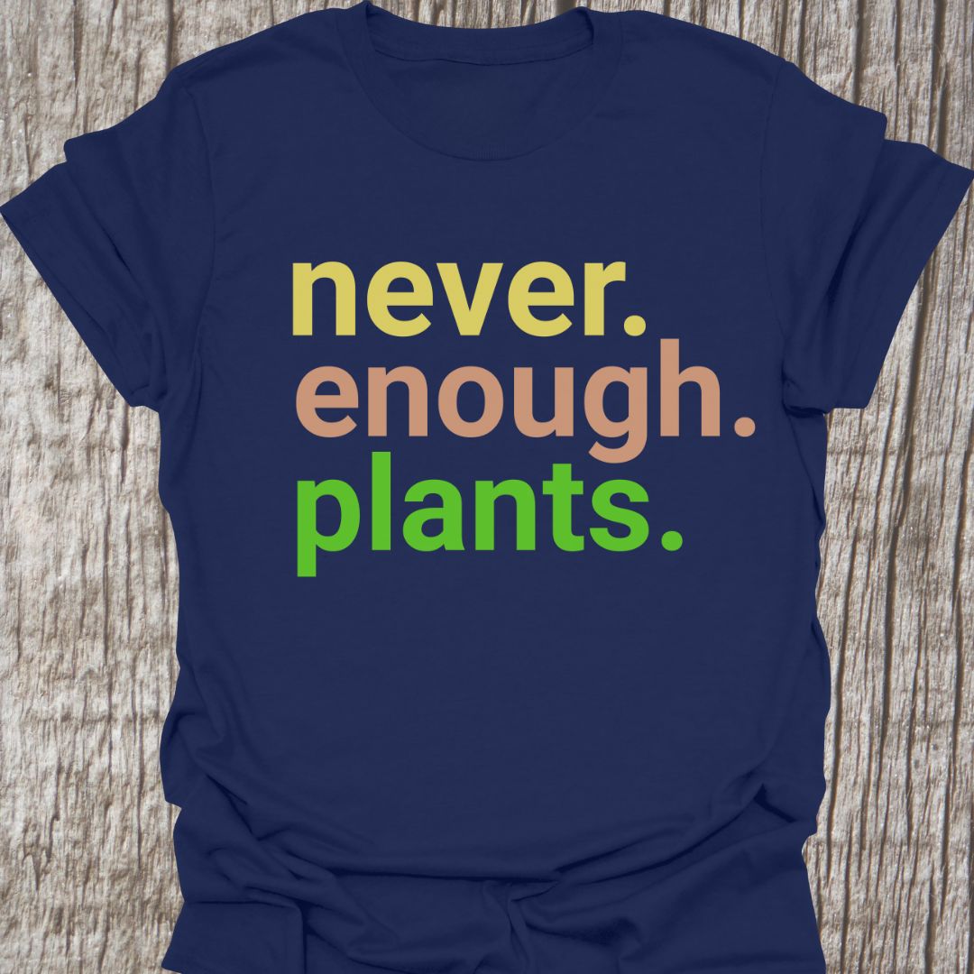 Text based design stating 'never enough plants' over three lines. Written in three colors on a navy t-shirt