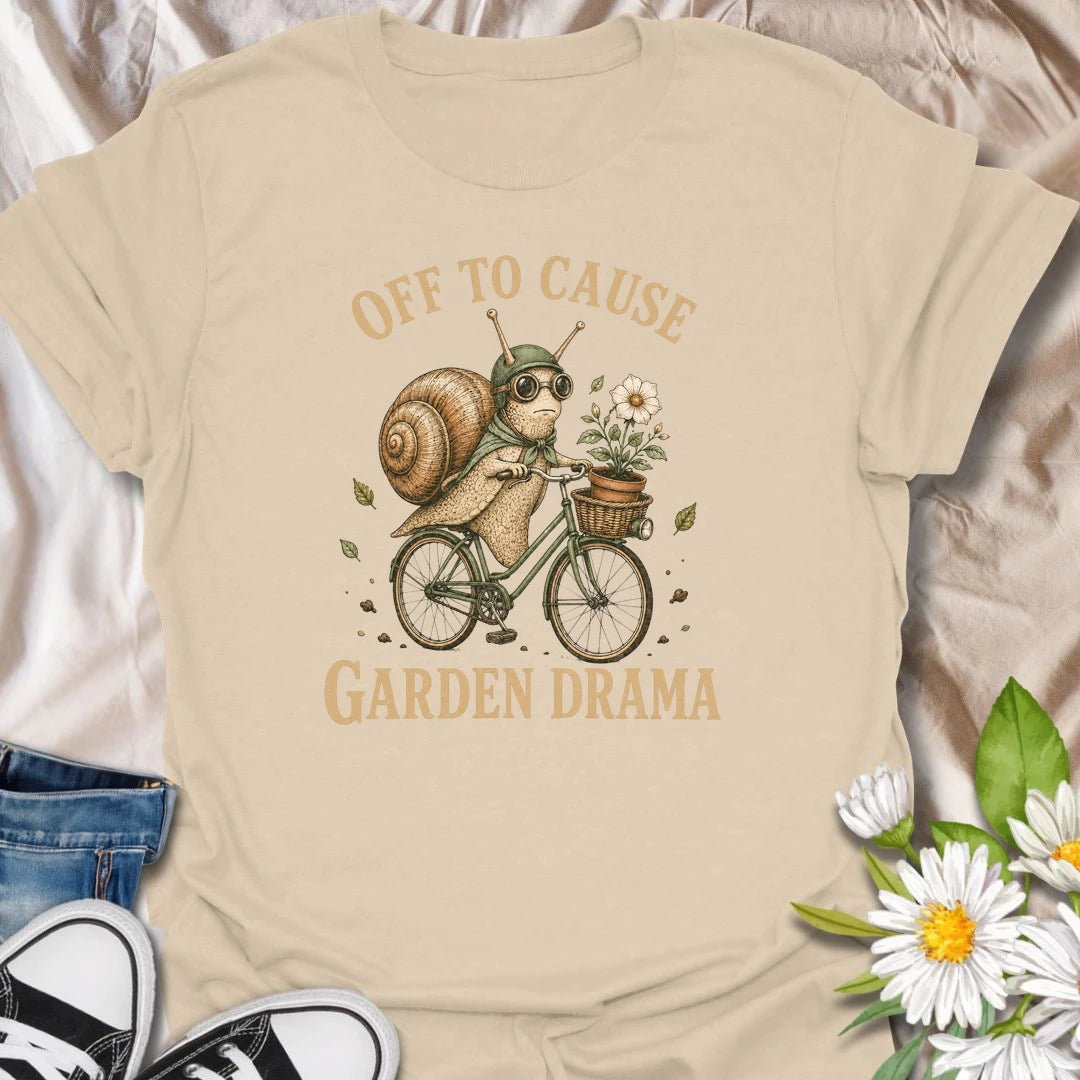 This Off To Cause Garden Drama t-shirt is perfect for gardeners, snail lovers, and plant people with a playful sense of humor. Featuring a vintage-style snail riding a bicycle with a flower pot and botanical details, this funny garden design is great for plant lovers, cottagecore fans, nature lovers, and anyone who enjoys whimsical garden chaos.