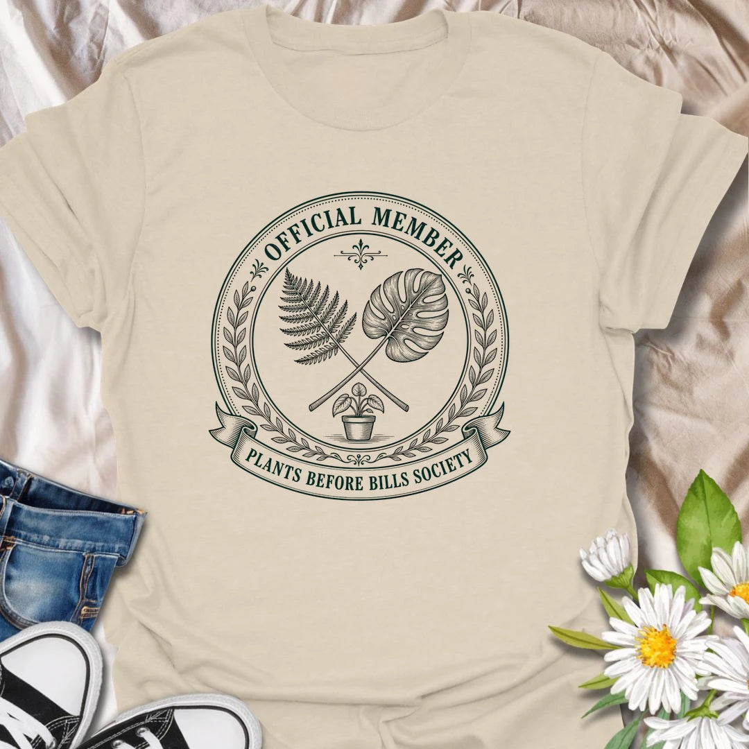 Plants Before Bills t-shirt for plant lovers who know their priorities are leafy, rooted, and usually sitting in a pot.
The official member badge design gives this shirt a vintage botanical society feel with fern, monstera, and potted plant details.
It is perfect for plant moms, houseplant collectors, indoor gardeners, and anyone tempted by plants before responsibilities.
A funny gift for plant people who proudly belong to the plants-before-bills lifestyle.