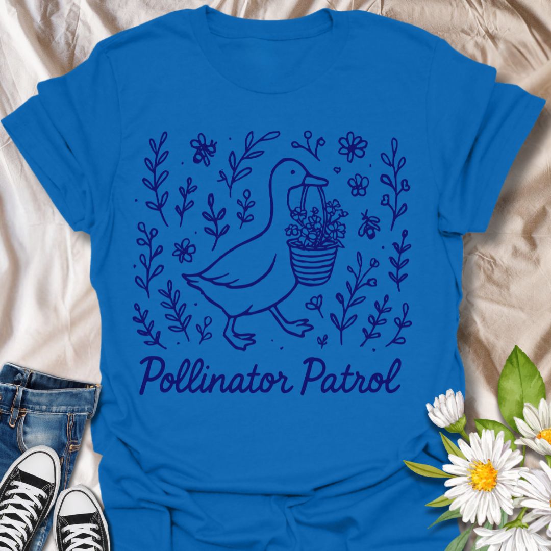 Charming ‘Pollinator Patrol’ goose shirt featuring a goose carrying flowers surrounded by bees and blooms. Perfect for gardeners, beekeepers, and wildlife conservation enthusiasts