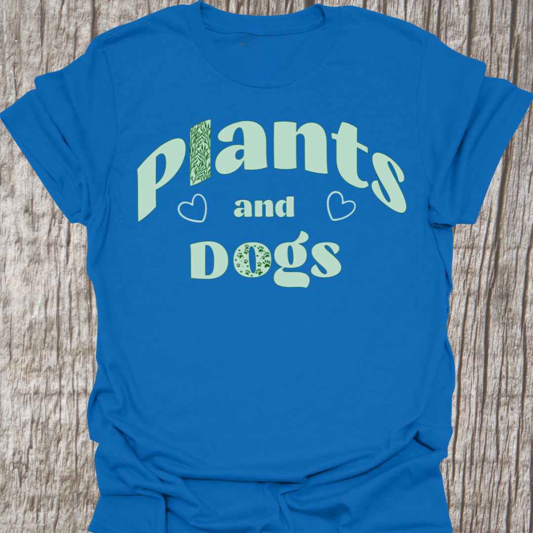 Plants and Dogs in text with subtle paw prints and leaves within the text design, decorated with two small hearts. Light green on a royal blue t-shirt