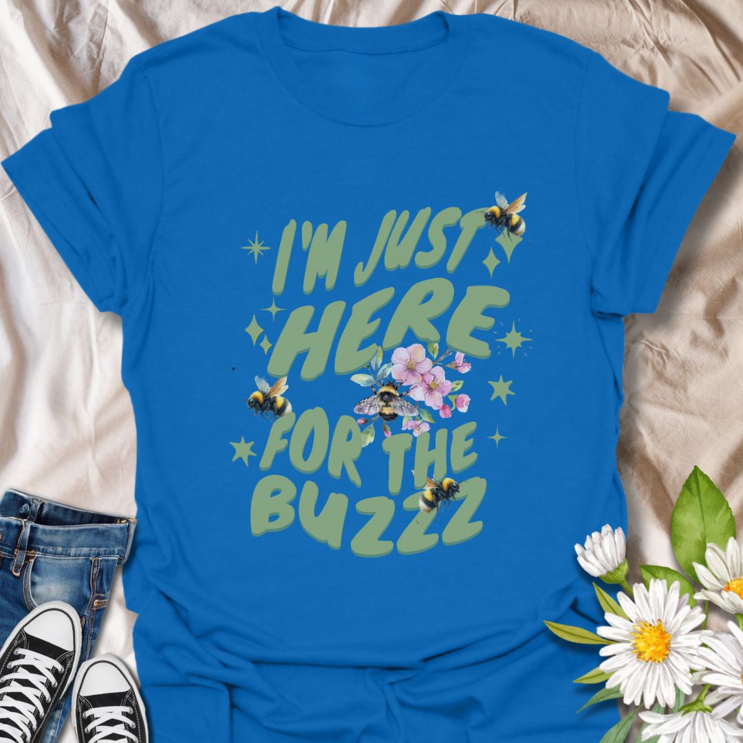 Celebrate your love for bees and humor with this fun "I'm Just Here for the Buzz" design. Adorned with buzzing bees, flowers, and playful lettering, it's perfect for bee enthusiasts, gardeners, or anyone who loves a good pun.