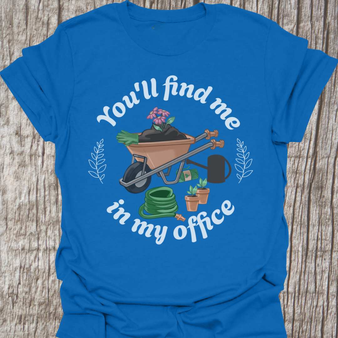 circular text 'You'll find me in my office' with wheelbarrow, hose, plants and watering can within circle all text in white on royal blue t-shirt