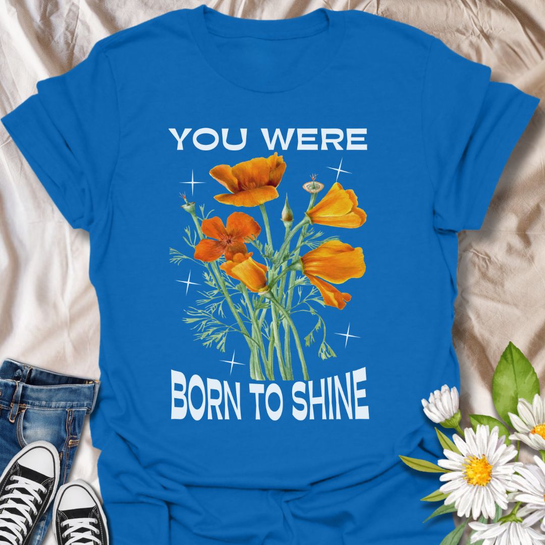 Shine bright with this motivational floral graphic t-shirt featuring vibrant orange poppies and the uplifting phrase "You Were Born to Shine." Perfect for positivity seekers, flower lovers, and anyone who enjoys bold, inspirational, and nature-inspired apparel.