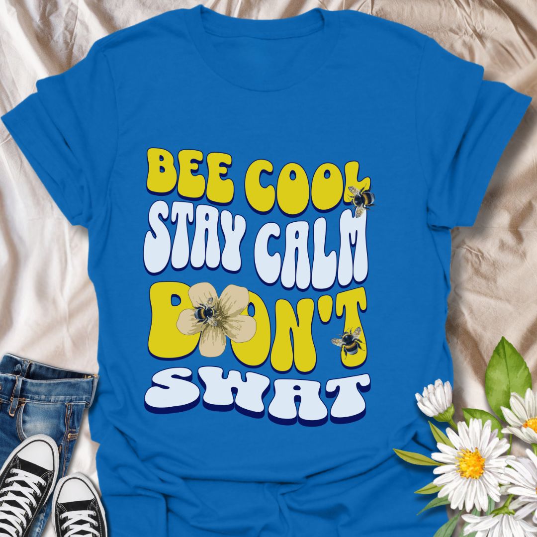Playful bee-themed t-shirt with "Bee Cool Stay Calm Don't Swat" design. Fun gift for bee lovers, pollinator enthusiasts, and anyone who appreciates a lighthearted garden vibe. Royal blue
