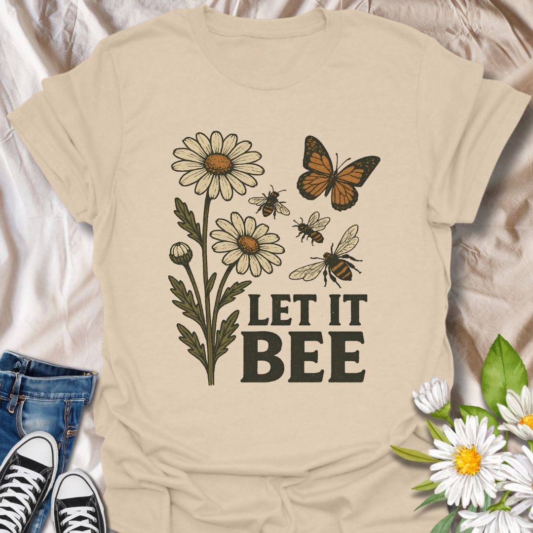Spread a positive eco-friendly message with this charming graphic t-shirt featuring daisies, bees, a butterfly, and the playful phrase "Let It Bee." Perfect for pollinator supporters, nature lovers, and anyone who enjoys whimsical botanical-themed apparel.