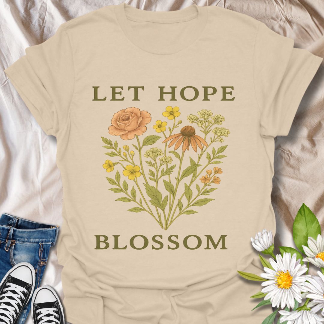 Inspire positivity with this beautifully illustrated floral graphic t-shirt featuring the uplifting phrase "Let Hope Blossom." A perfect choice for nature lovers, flower enthusiasts, and anyone who embraces optimism and growth through meaningful, botanical-themed apparel.