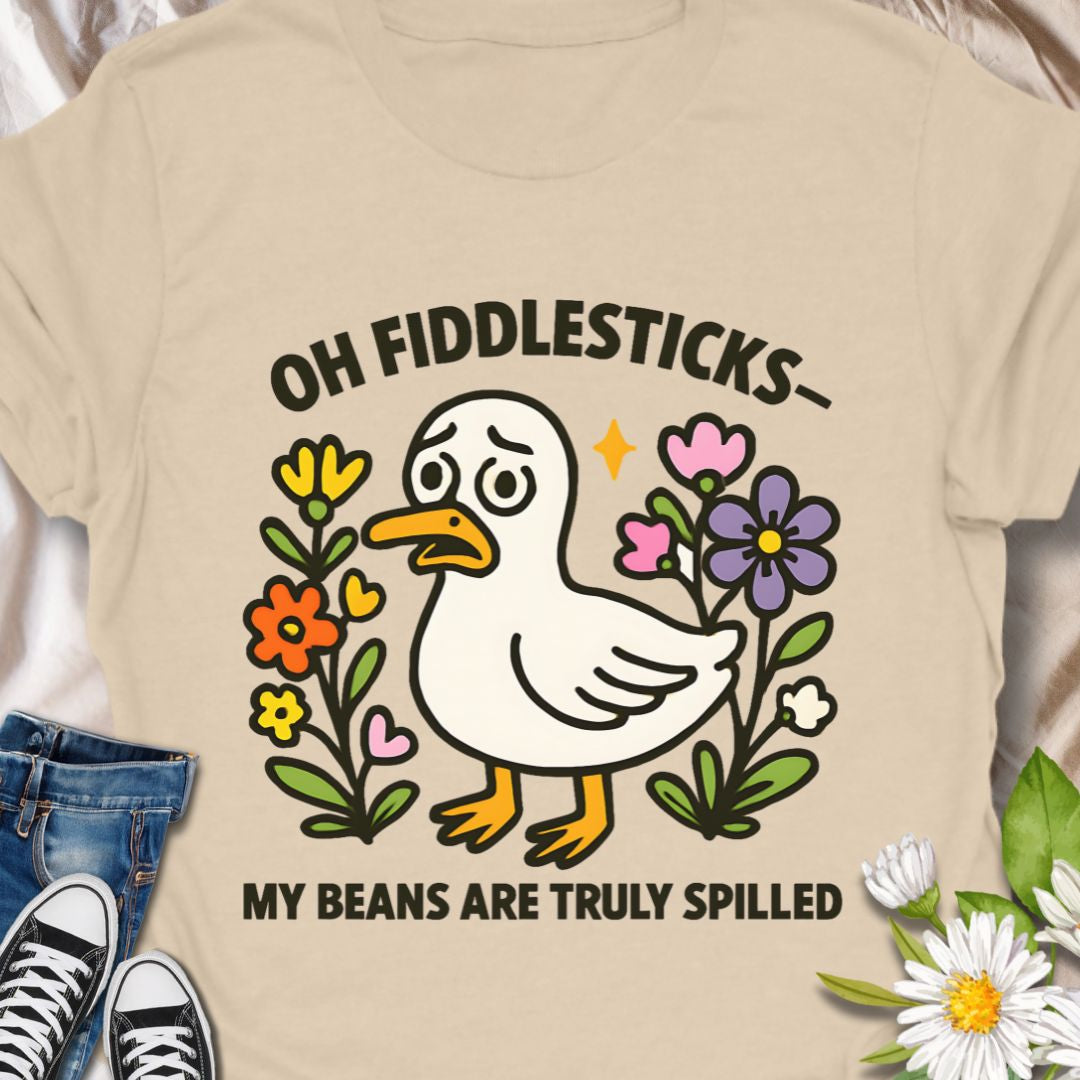 This adorable duck t-shirt featuring the phrase "Oh Fiddlesticks – My Beans Are Truly Spilled" blends wholesome humor with colorful floral charm. Perfect for anyone who thrives on quirky expressions and cute designs. Great gift for the emotionally expressive with the playful, slightly bewildered duck. Wear it when you want to spark a smile, or share a goofy moment.