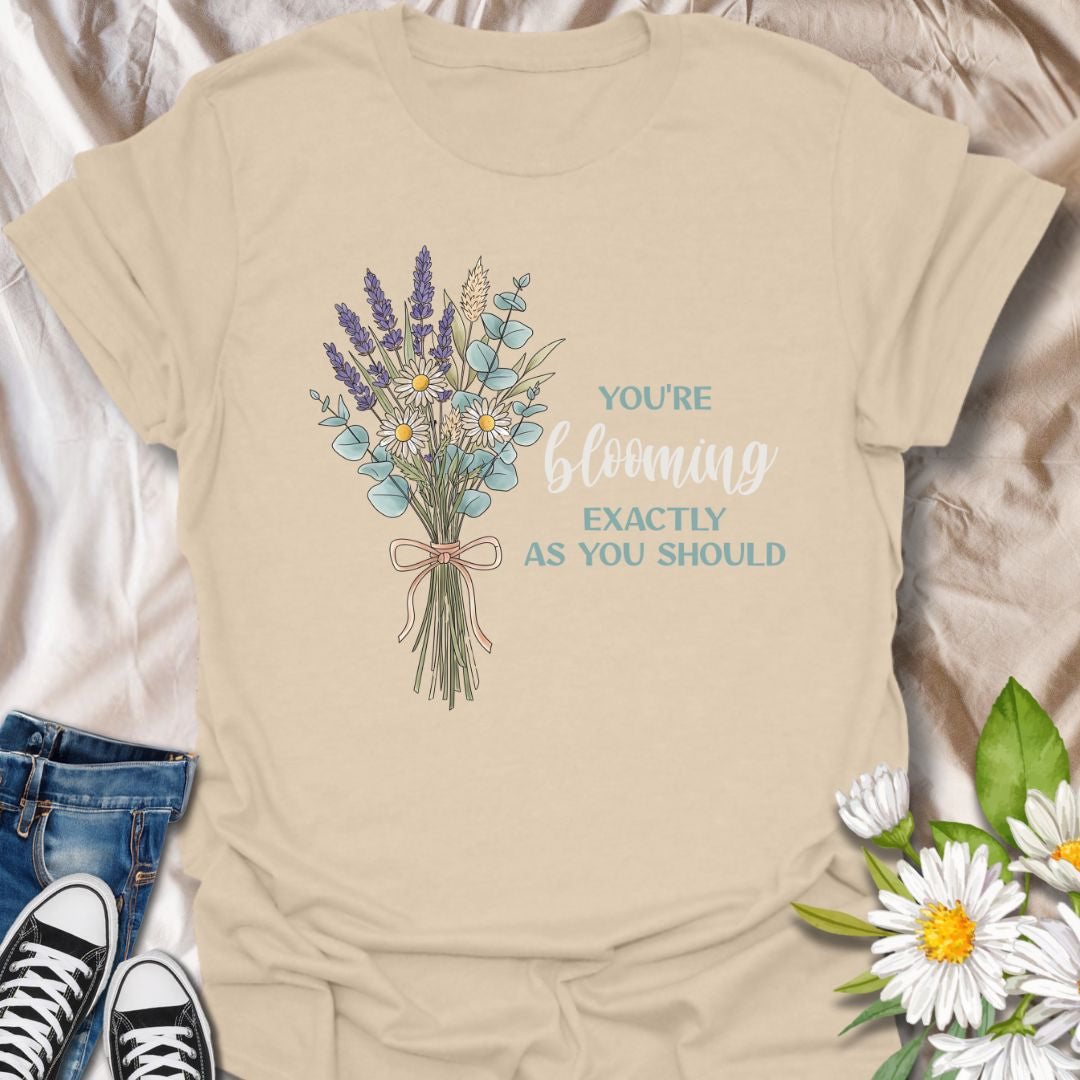 You’re blooming exactly as you should. This uplifting botanical t-shirt features a delicate wildflower bouquet and a positive affirmation celebrating growth, self-confidence, and gentle living. A meaningful gift for plant lovers, gardeners, and anyone on their own blooming journey.
