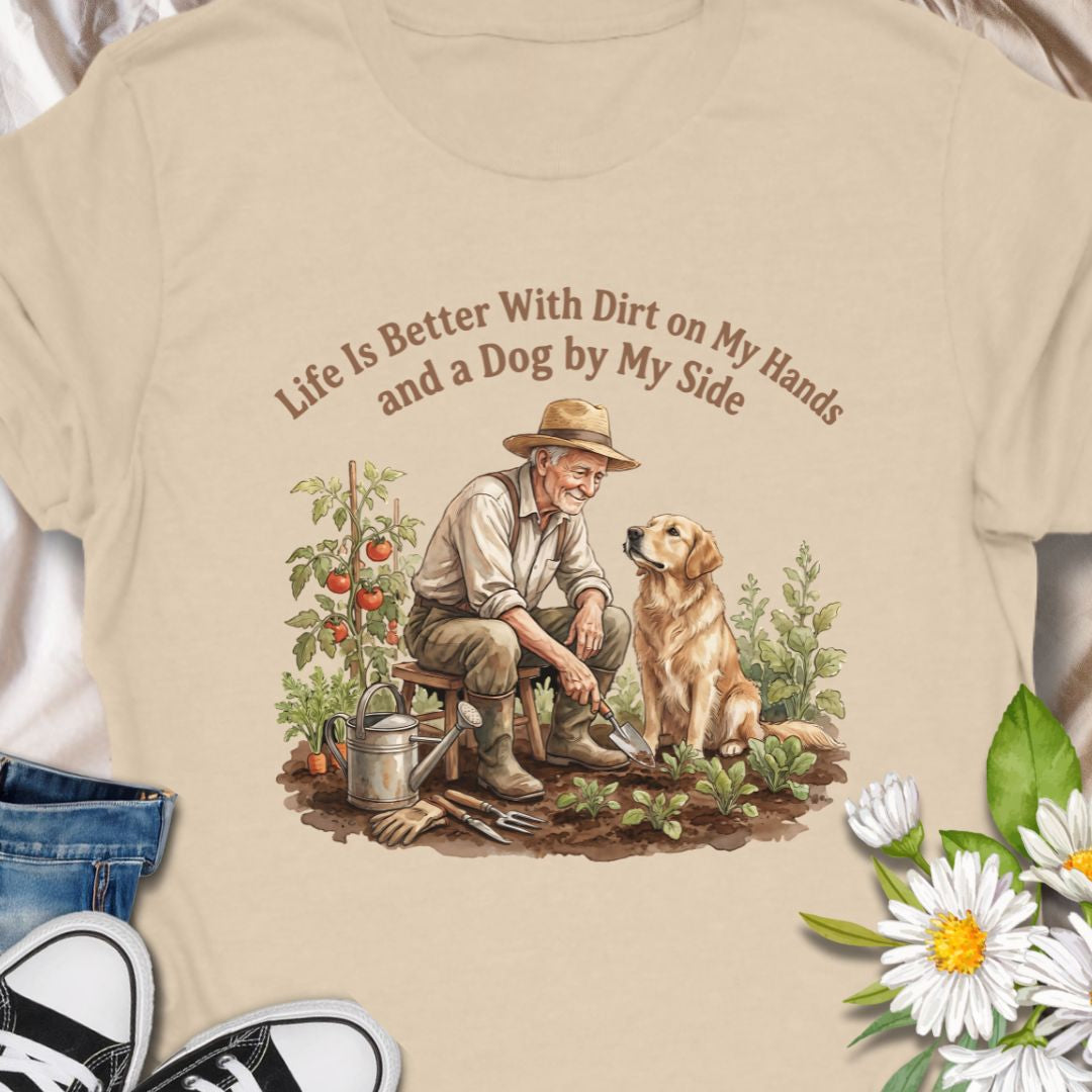 Celebrate the joys of gardening and loyal companionship with this heart warming “Life Is Better With Dirt on My Hands and a Dog by My Side” t-shirt. Featuring a vintage-style illustration of a man and his dog in the garden, this tee is perfect for nature lovers, dog dads, or anyone who finds peace in plants and paws. A thoughtful gift for birthdays, Father’s Day, or just because.