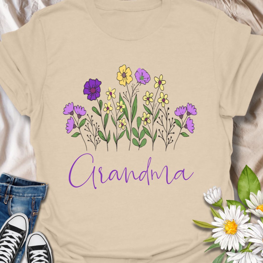 Celebrate the love of a grandmother with this beautiful "Grandma" floral t-shirt. Featuring a charming hand-drawn bouquet and elegant script, this tee is the perfect gift for birthdays, Mother's Day, or just because. Ideal for flower-loving grandmas who bloom with love and wisdom.
