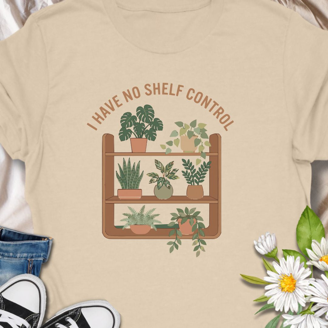 Celebrate your love for plants and witty humor with this “I Have No Shelf Control” t-shirt, featuring a cozy plant shelf filled with greenery. Perfect for houseplant lovers, plant collectors, and green-thumbed decor enthusiasts. A must-have for anyone who keeps adding plants to their shelves—no regrets!