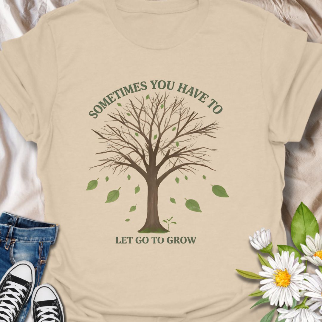 Embrace change and personal growth with this inspirational “Sometimes You Have to Let Go to Grow” t-shirt. Featuring a minimalist tree shedding leaves, this motivational nature-themed design is perfect for anyone navigating transformation, healing, or new beginnings. A thoughtful gift for plant lovers, nature fans, or those on a journey of self-growth.