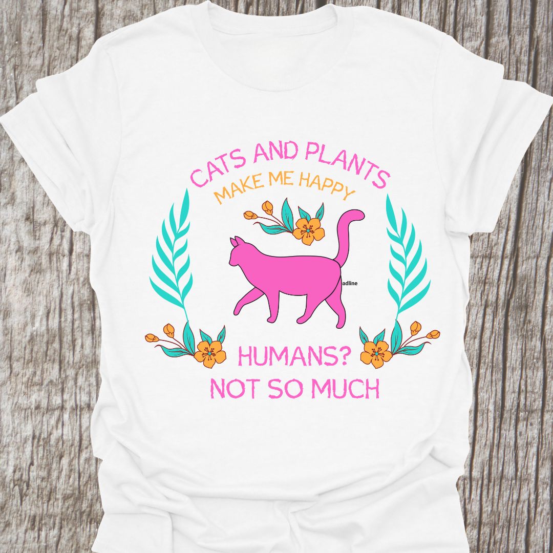 Cat and Plants Make Me Happy, Humans? Not So Much text and image design with pink cat as main image and decorative leaves, and flowers. White t-shirt