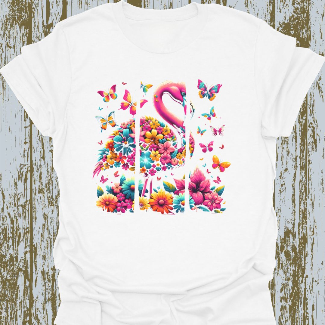 A design featuring flamingos, butterflies, and flowers in pink, yellow, and blue hues on white t-shirt.