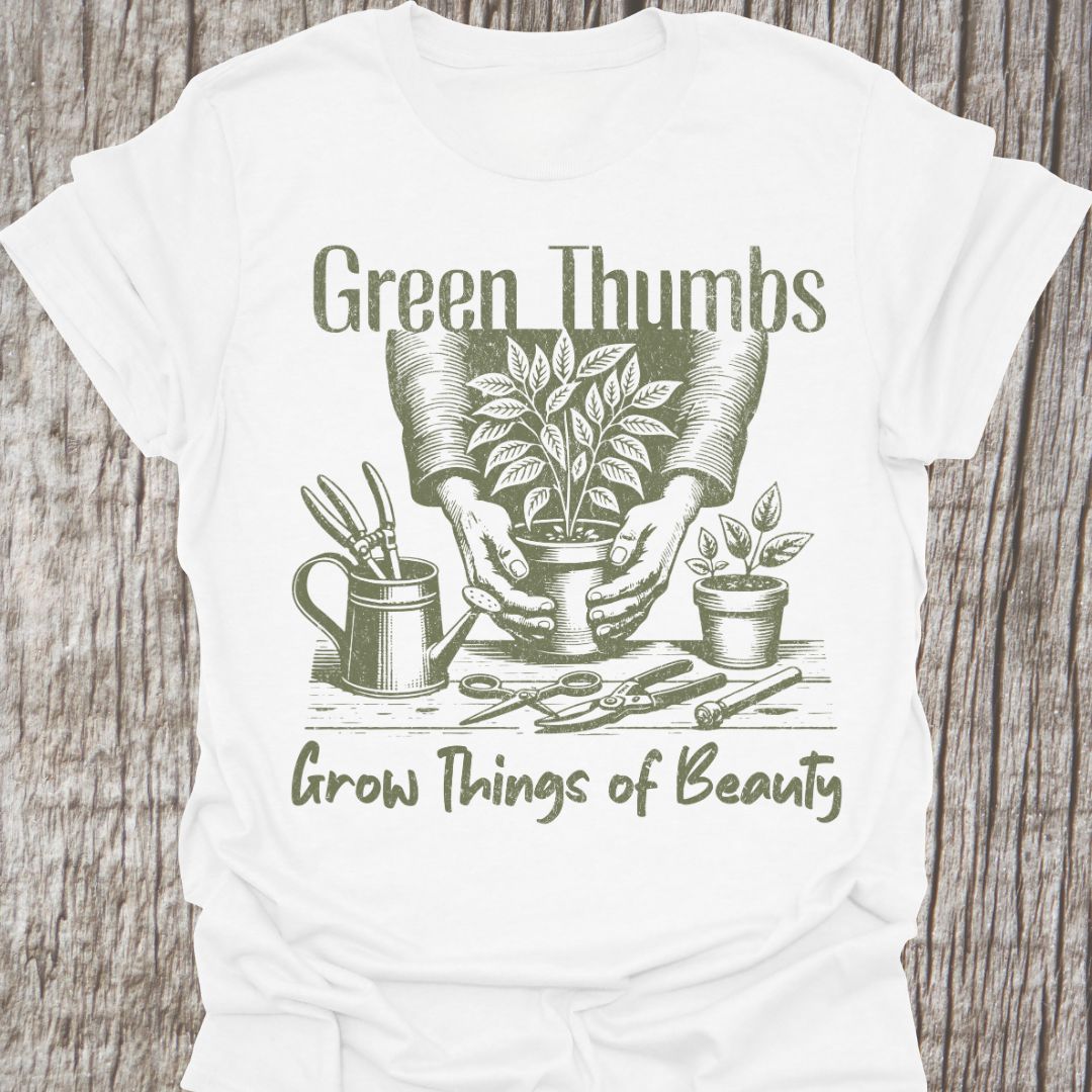 Green Thumbs Grow Things of Beauty text with image of hands holding a plant pot and garden implements around on a whitet-shirt