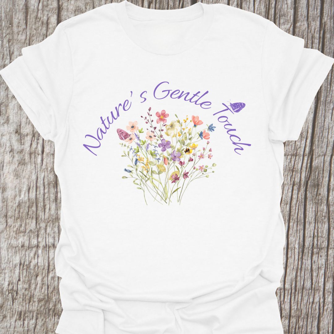 Beautiful flowers white T-shirt, 'Nature's Gentle Touch' curving around flowers in a lilac font, and a butterfly gently resting within the design.