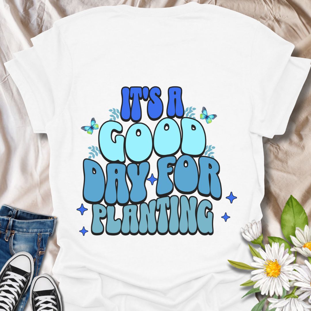 Bright and cheerful "It's a Good Day for Planting" t-shirt featuring retro-style typography with playful butterflies and vibrant blue tones. Perfect for gardeners, plant lovers, and anyone who finds joy in planting flowers and tending to nature. This planting t-shirt is an Ideal gardening gift, outdoor hobby shirt, botanical fashion, nature lover apparel, and springtime outfit.