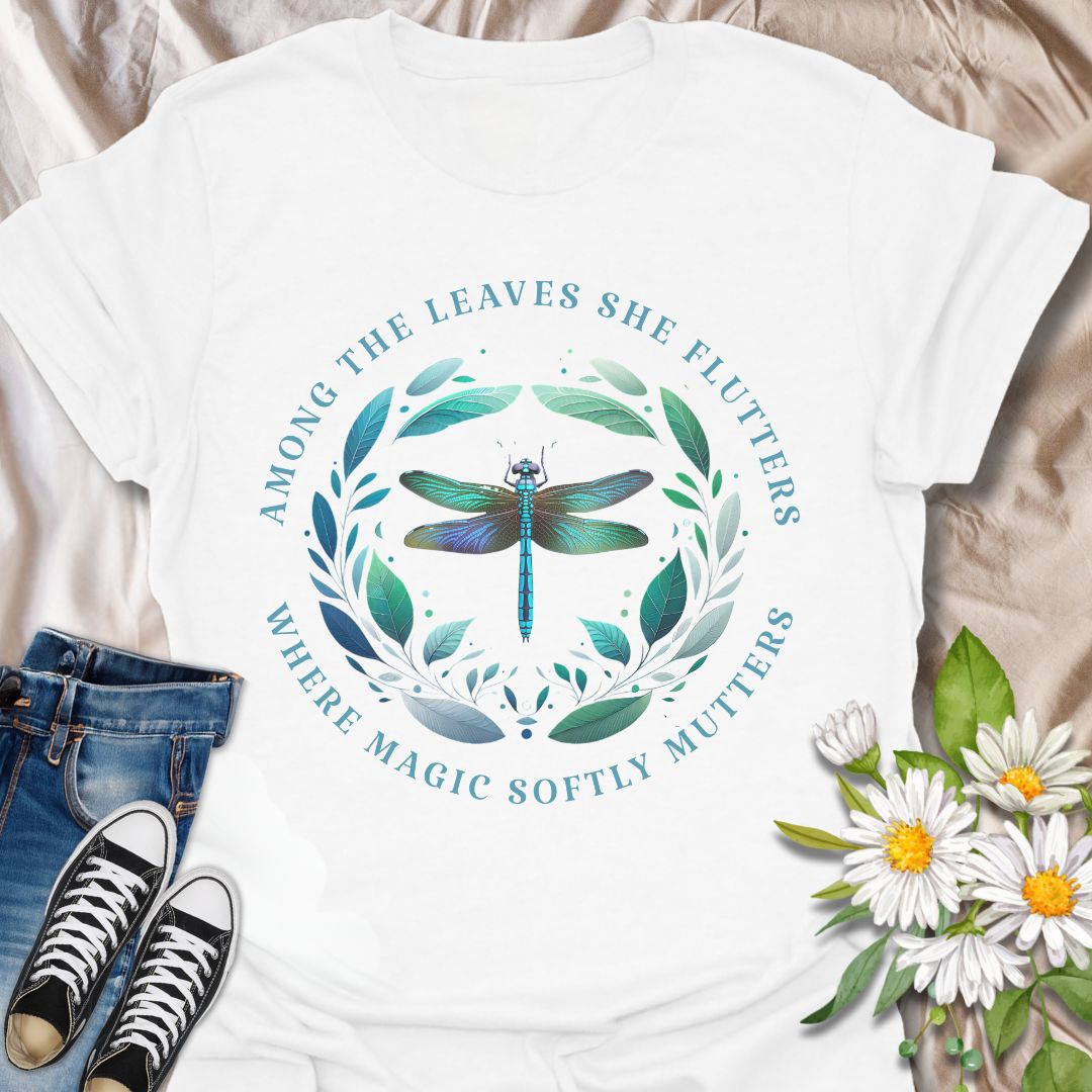 Mystical dragonfly t-shirt with detailed wings and a leafy circle, wrapped in the phrase “Among the leaves she flutters, where magic softly mutters.” A magical nature design for dreamers, woodland lovers, and poetic souls.