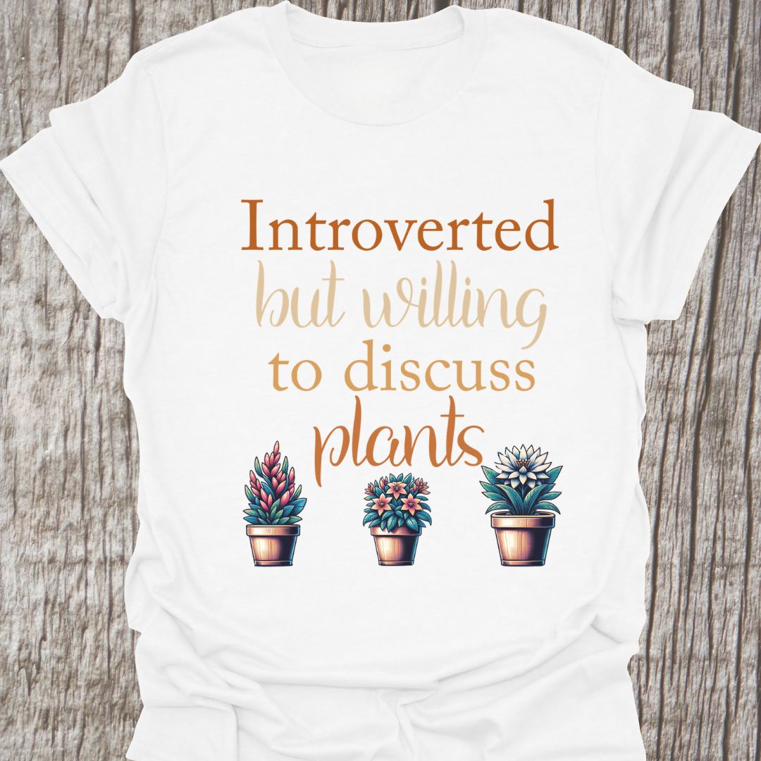 Introverted but willing to discuss plants in natural colored text with image of three flowering pot plants, on a white t-shirt