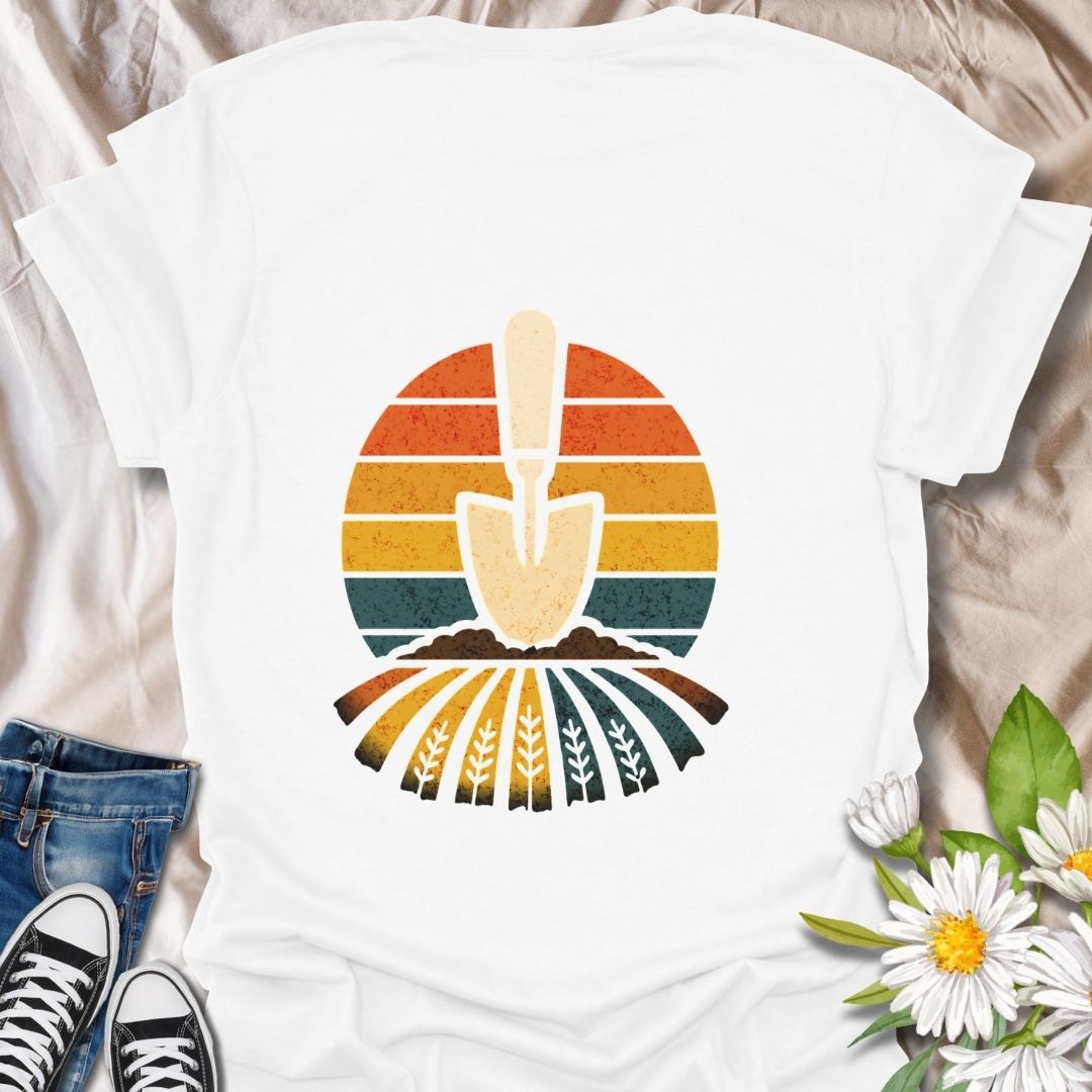 Retro gardening t-shirt featuring a vintage-style trowel and sunset field design. Perfect gift for gardeners, farmers, and nature lovers. Bold and earthy outdoor wear.