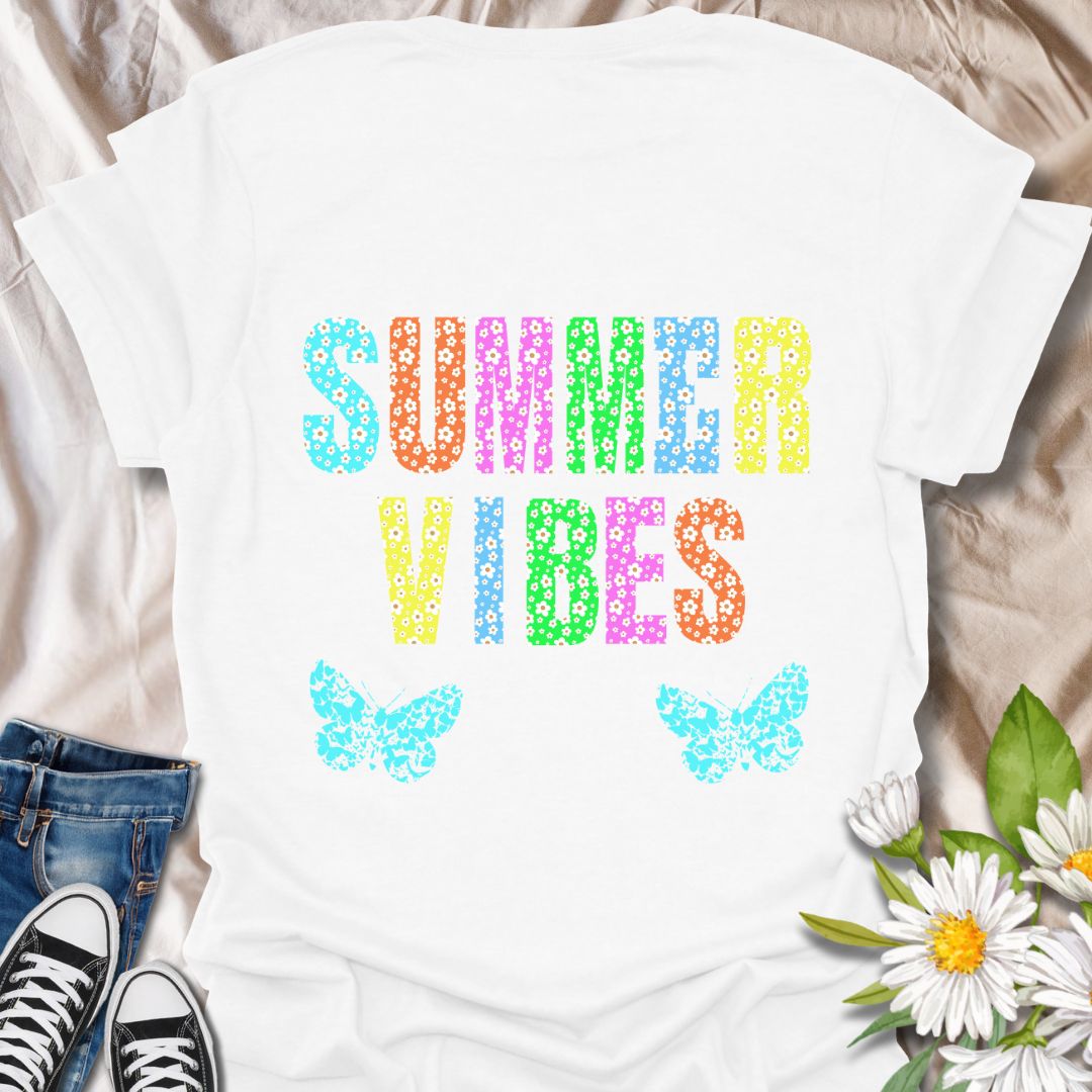 Bright and colorful "Summer Vibes" t-shirt with bold floral letters and butterfly accents. Perfect summer fashion for beach trips, vacations, festivals, or casual days. Ideal gift for anyone who loves sunshine, flowers, and vibrant summer style.
