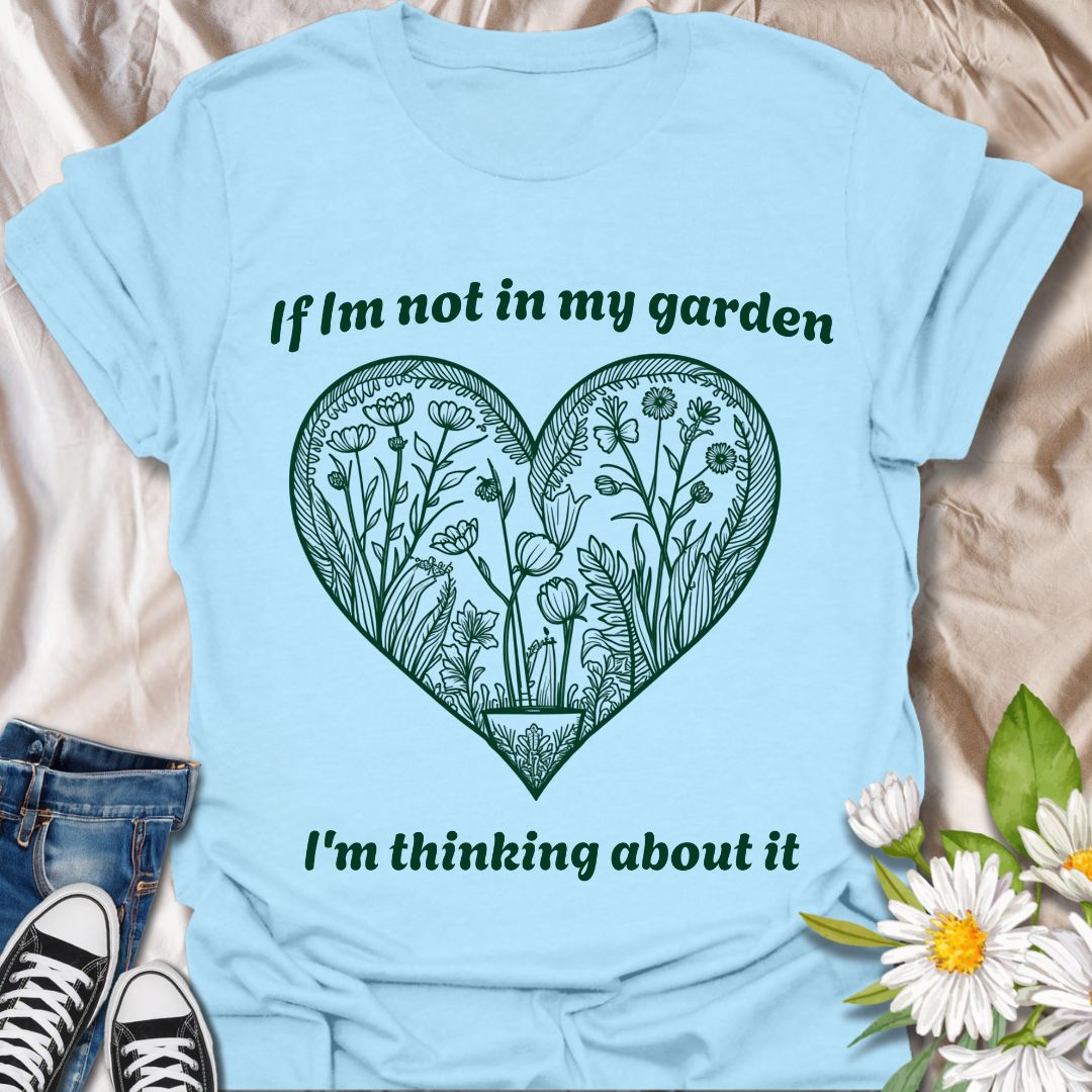 Show off your gardening passion with this beautifully illustrated heart-shaped floral design. Featuring the phrase “If I'm not in my garden, I'm thinking about it,” this shirt is perfect for plant lovers who dream of dirt, blooms, and backyard bliss.