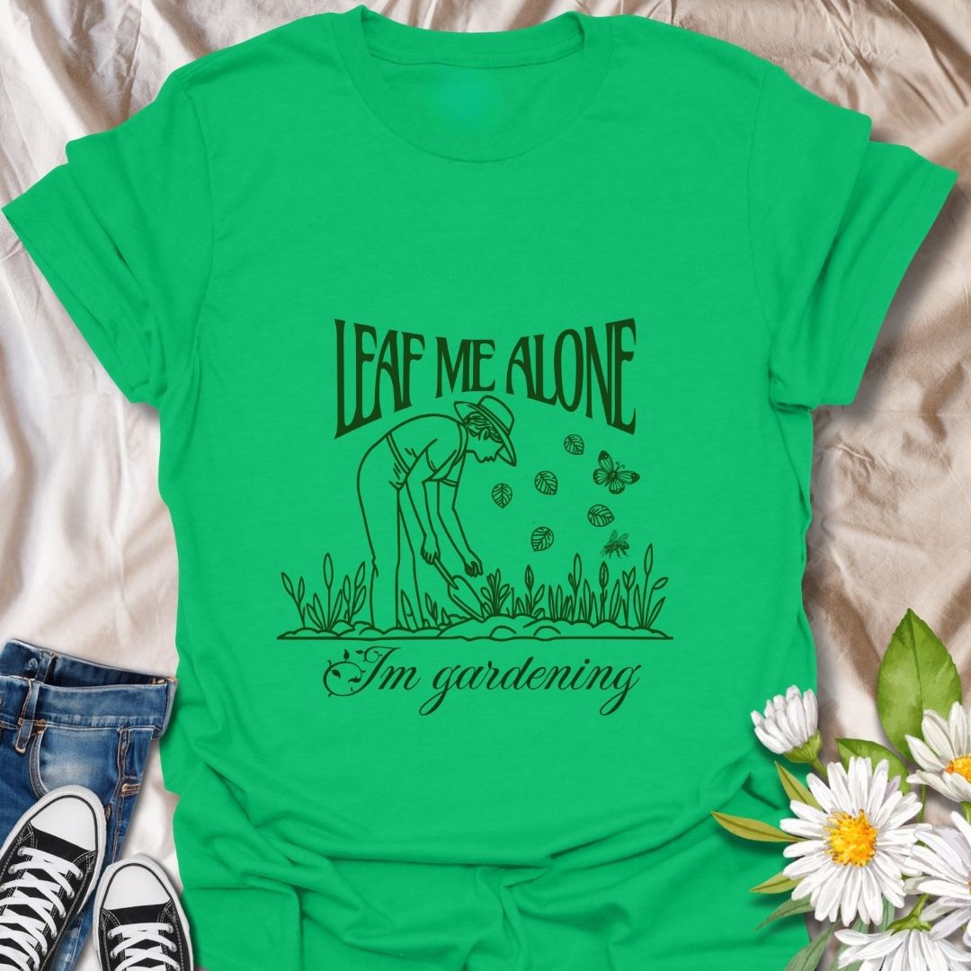 Perfect for plant lovers with a sense of humor! This "Leaf Me Alone I’m Gardening" t-shirt features a playful gardening pun with a simple, charming line art design. Great gift for gardeners who enjoy their peaceful time outdoors.