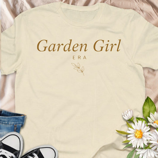 Step into your Garden Girl Era with this minimalist botanical t-shirt. A soft, feminine gardening tee perfect for plant lovers, cottagecore fans, and flower-obsessed women.