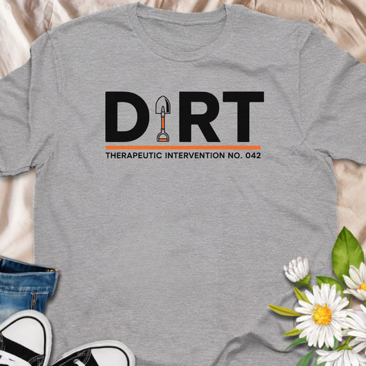 Clean, minimalist “Dirt – Therapeutic Intervention No. 042” t-shirt for gardeners and plant lovers. A subtle, witty gardening graphic tee perfect for hobby gardeners, plant moms, and anyone who finds peace in the soil.