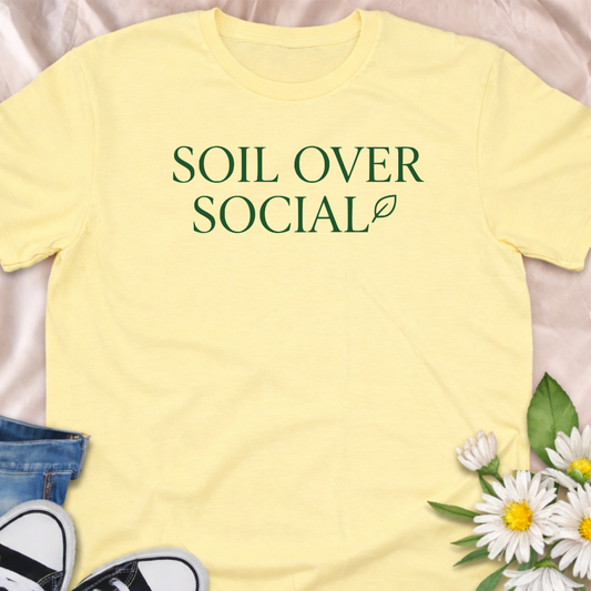 Bold “Soil Over Social” gardening t-shirt for plant lovers who’d rather be in the garden than online. A clean, minimalist botanical typography tee perfect for gardeners, plant moms, and cottagecore enthusiasts.