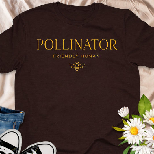 “Pollinator Friendly Human” t-shirt featuring elegant typography and a minimalist bee graphic. Perfect for gardeners, beekeepers, wildflower lovers, and anyone passionate about saving the bees and supporting pollinators.