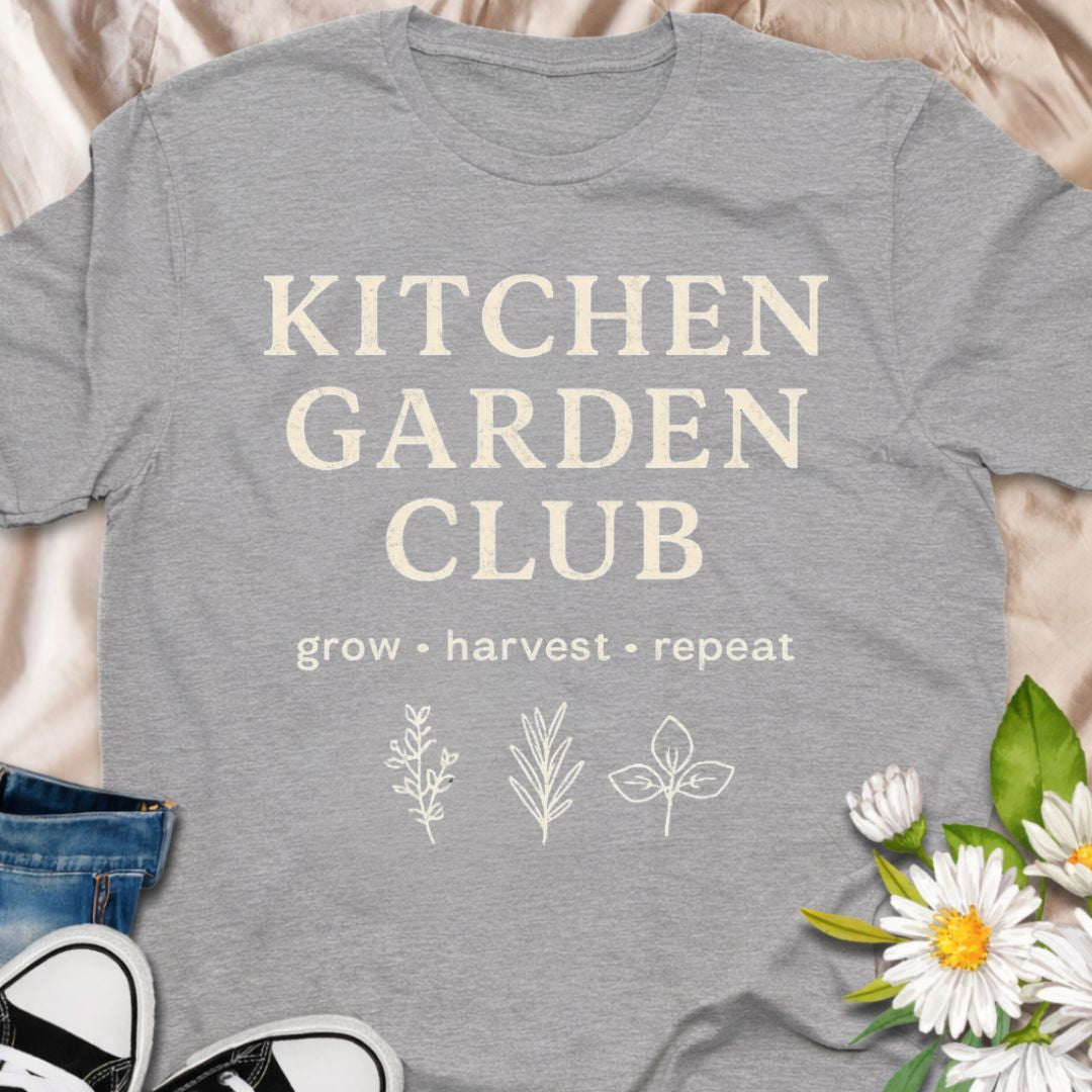 “Kitchen Garden Club – Grow • Harvest • Repeat” t-shirt for home growers and vegetable gardeners. A rustic botanical graphic tee perfect for herb lovers, backyard gardeners, and garden-to-table enthusiasts.