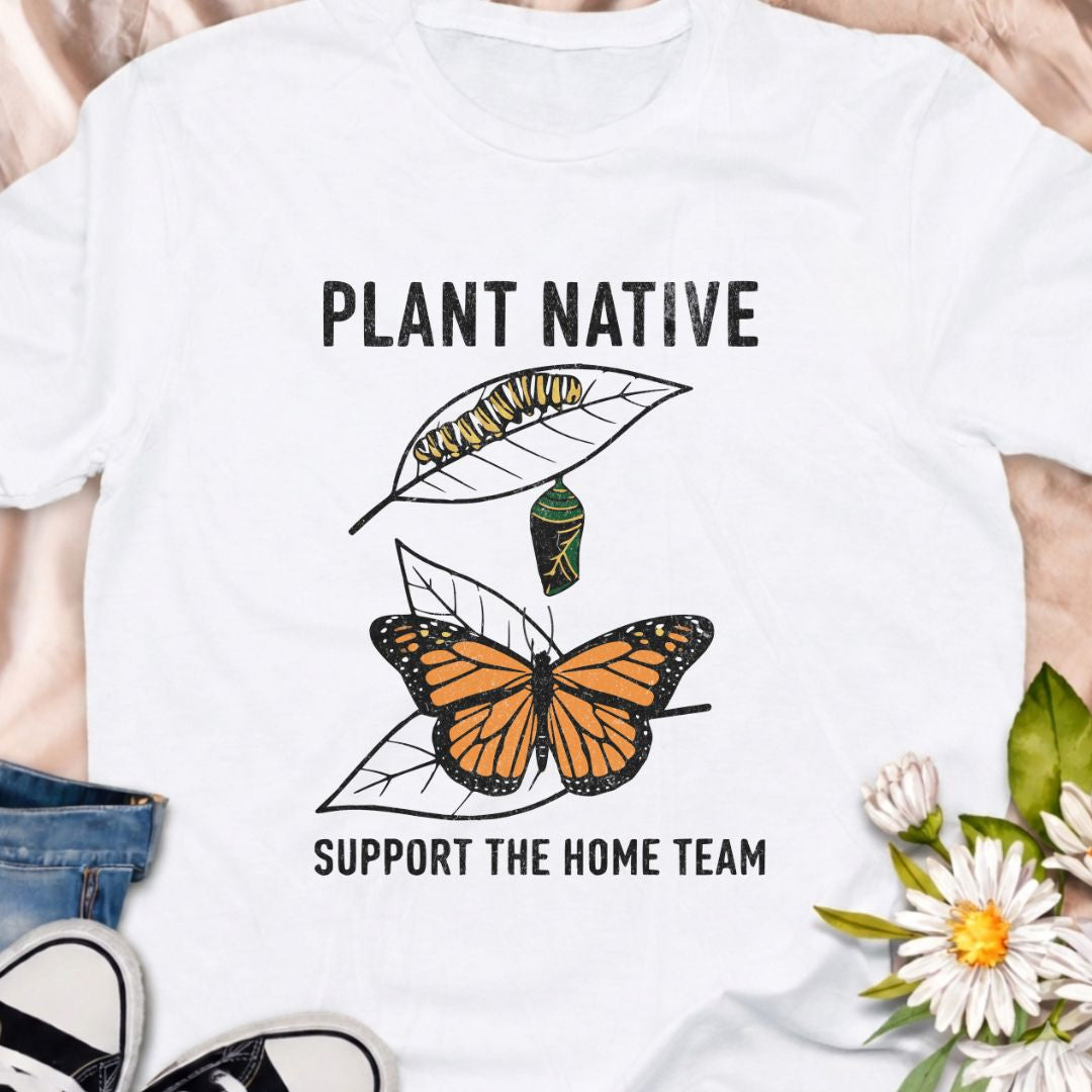 Plant native. Support the home team. This butterfly and native plant shirt celebrates sustainable gardening and local wildlife. Featuring a delicate nature-inspired design, this soft unisex tee is perfect for pollinator gardeners, native plant lovers, and eco-conscious nature enthusiasts.