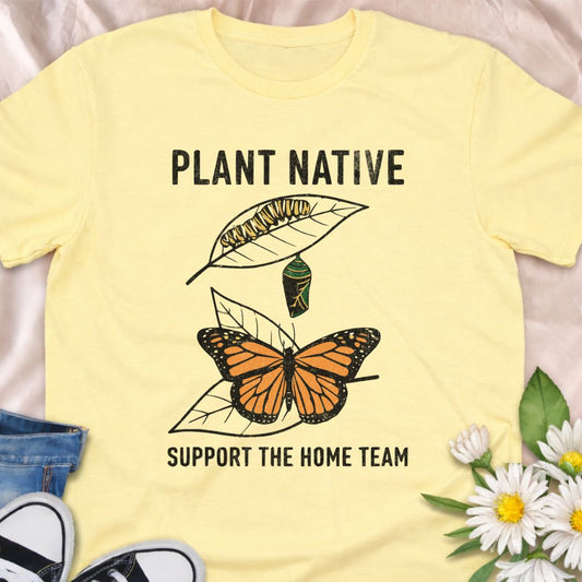 Plant native. Support the home team. This butterfly and native plant shirt celebrates sustainable gardening and local wildlife. Featuring a delicate nature-inspired design, this soft unisex tee is perfect for pollinator gardeners, native plant lovers, and eco-conscious nature enthusiasts.