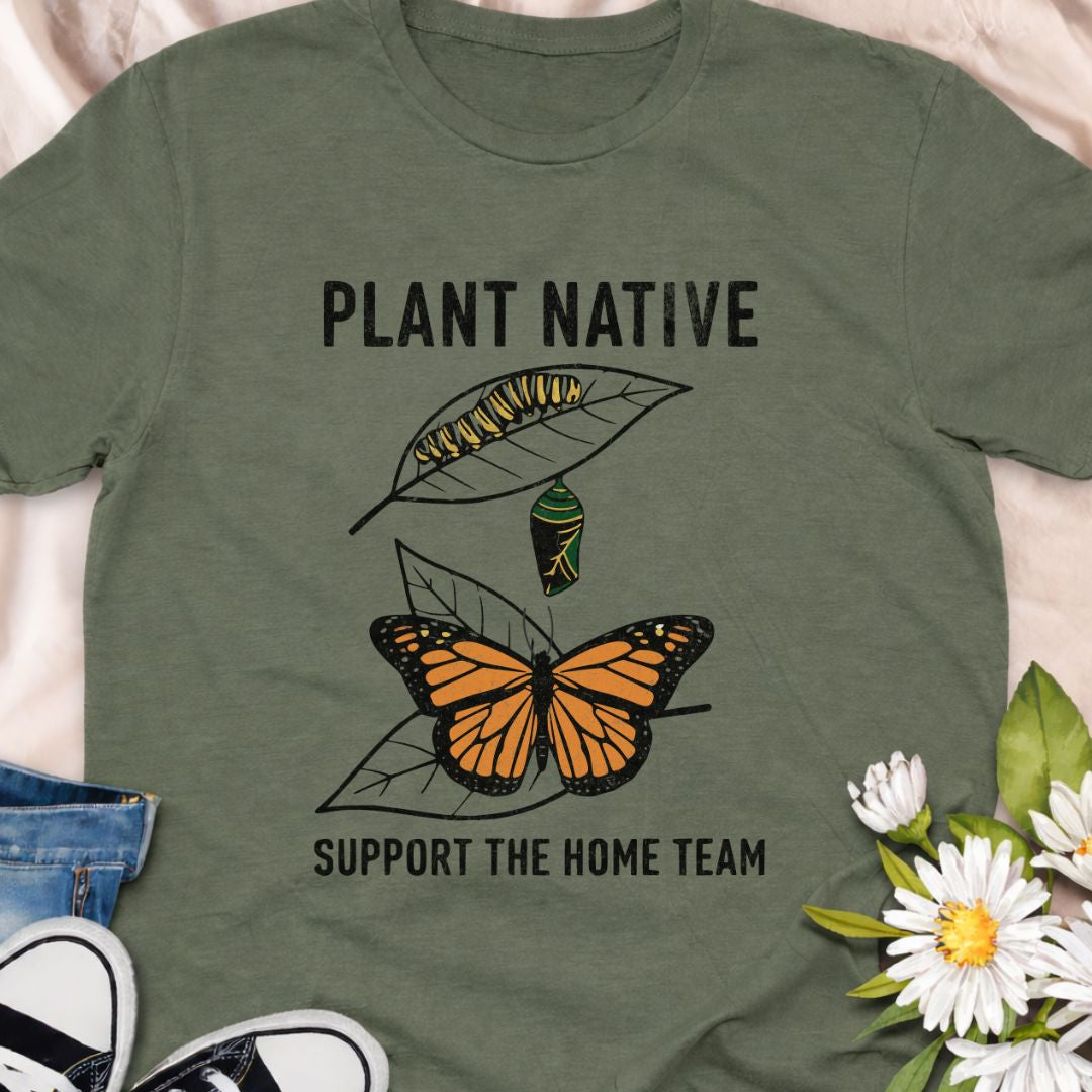 Plant native. Support the home team. This butterfly and native plant shirt celebrates sustainable gardening and local wildlife. Featuring a delicate nature-inspired design, this soft unisex tee is perfect for pollinator gardeners, native plant lovers, and eco-conscious nature enthusiasts.
