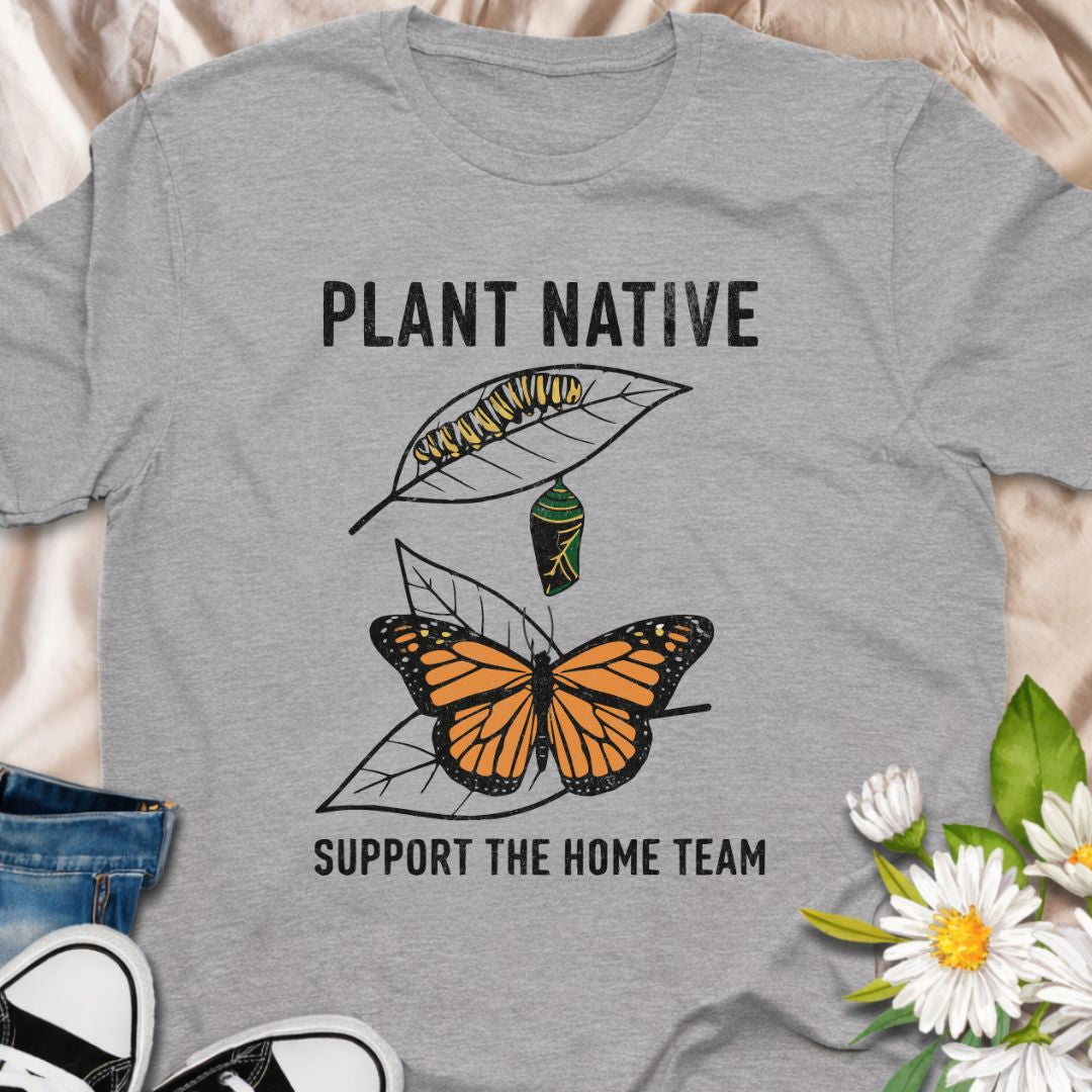 Plant native. Support the home team. This butterfly and native plant shirt celebrates sustainable gardening and local wildlife. Featuring a delicate nature-inspired design, this soft unisex tee is perfect for pollinator gardeners, native plant lovers, and eco-conscious nature enthusiasts.