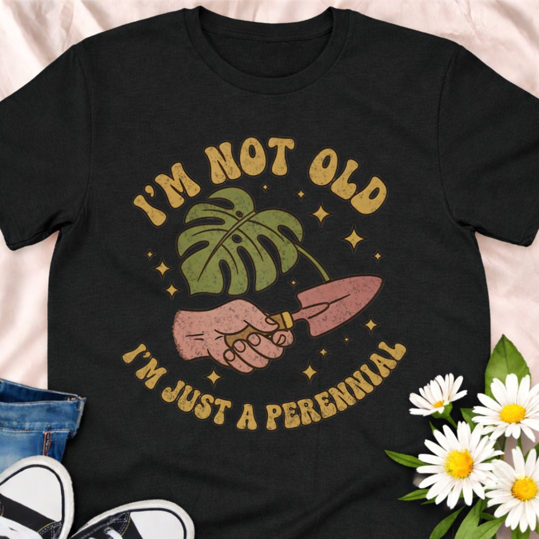 Celebrate aging with humor in this “I’m Not Old, I’m Just a Perennial” gardening t-shirt. A funny plant lover shirt perfect for gardeners, plant moms, and anyone who knows perennials only get better with time. Great gift for birthdays, garden club friends, and botanical enthusiasts.