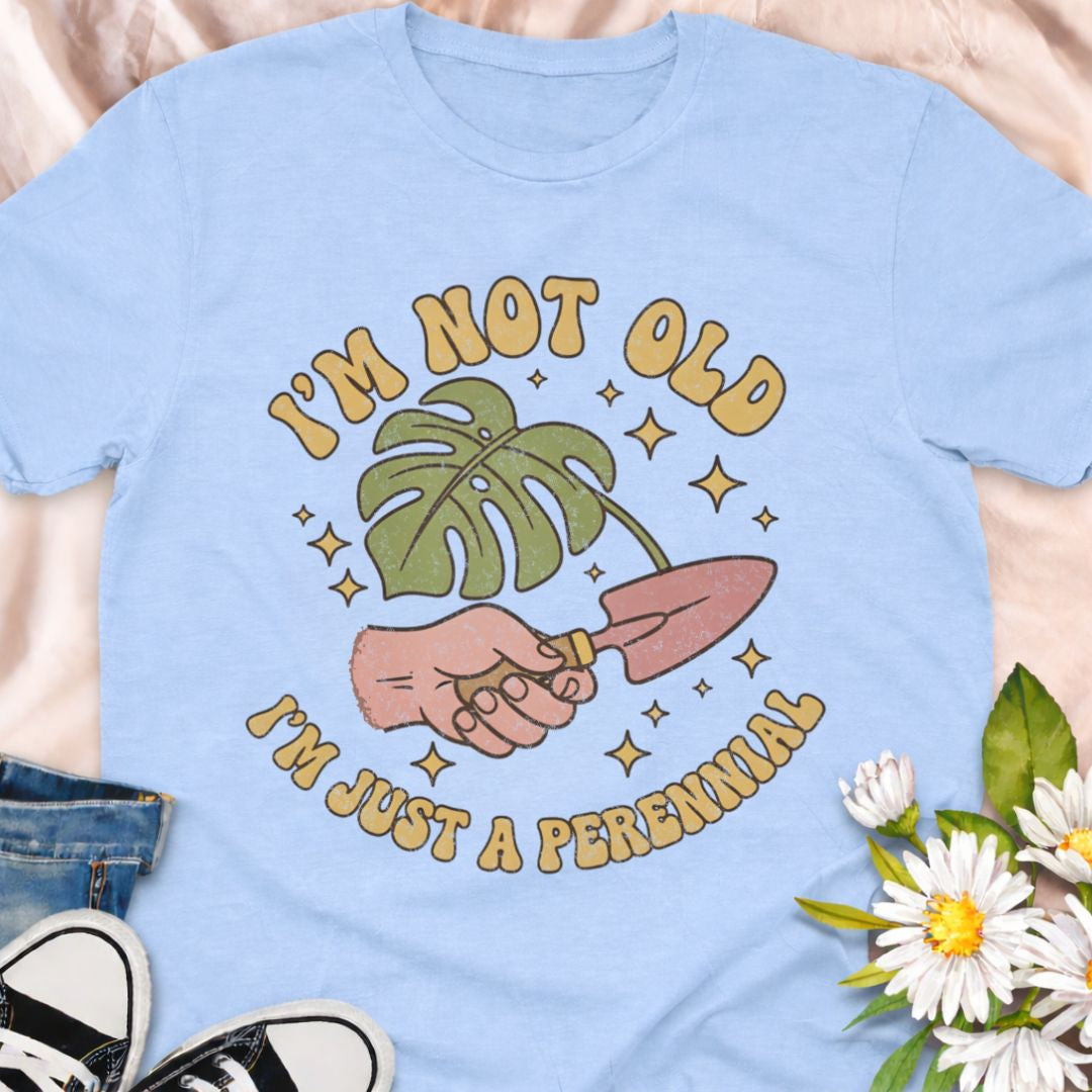 Celebrate aging with humor in this “I’m Not Old, I’m Just a Perennial” gardening t-shirt. A funny plant lover shirt perfect for gardeners, plant moms, and anyone who knows perennials only get better with time. Great gift for birthdays, garden club friends, and botanical enthusiasts.