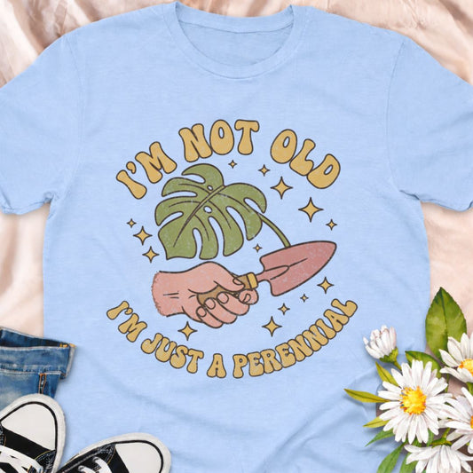 Celebrate aging with humor in this “I’m Not Old, I’m Just a Perennial” gardening t-shirt. A funny plant lover shirt perfect for gardeners, plant moms, and anyone who knows perennials only get better with time. Great gift for birthdays, garden club friends, and botanical enthusiasts.