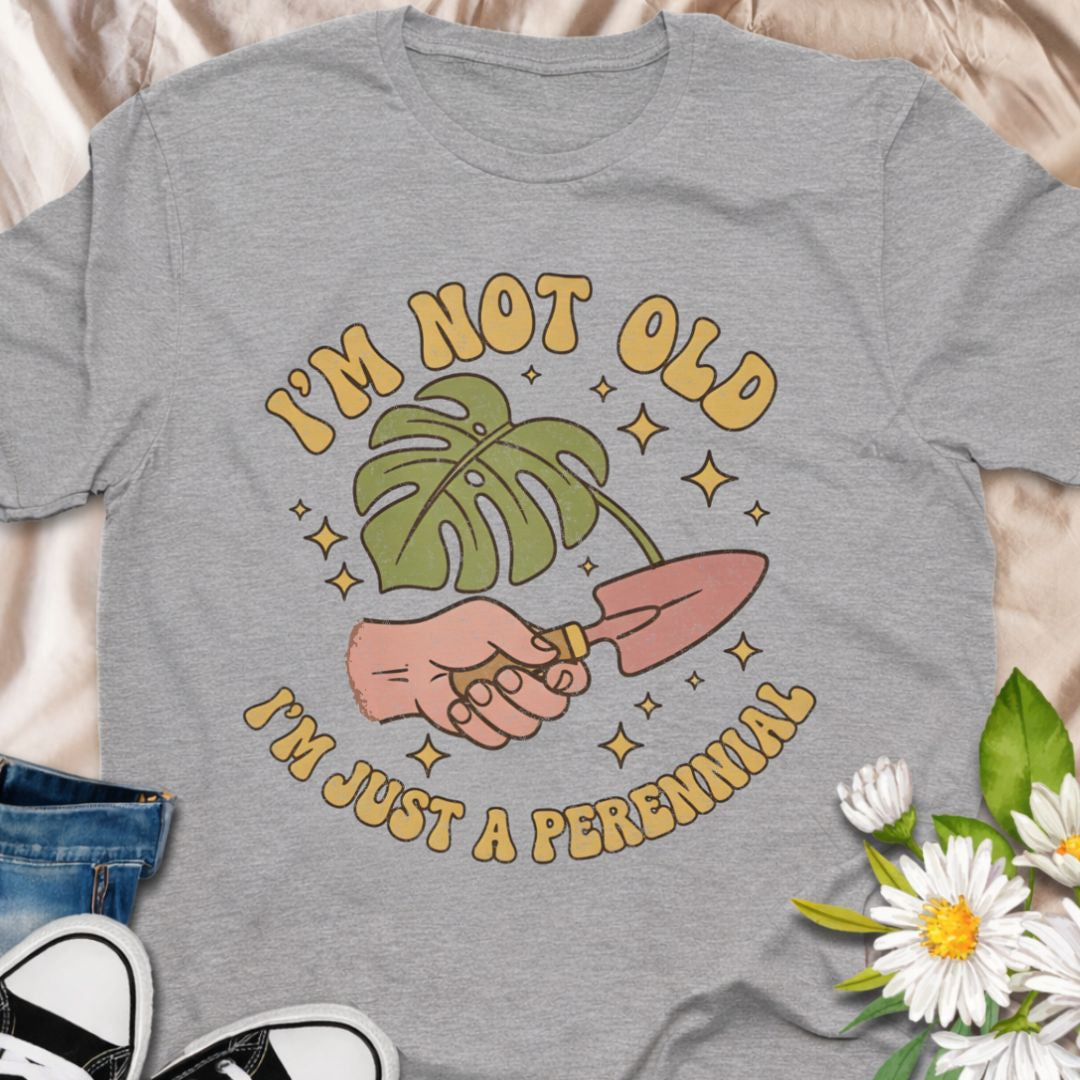 Celebrate aging with humor in this “I’m Not Old, I’m Just a Perennial” gardening t-shirt. A funny plant lover shirt perfect for gardeners, plant moms, and anyone who knows perennials only get better with time. Great gift for birthdays, garden club friends, and botanical enthusiasts.