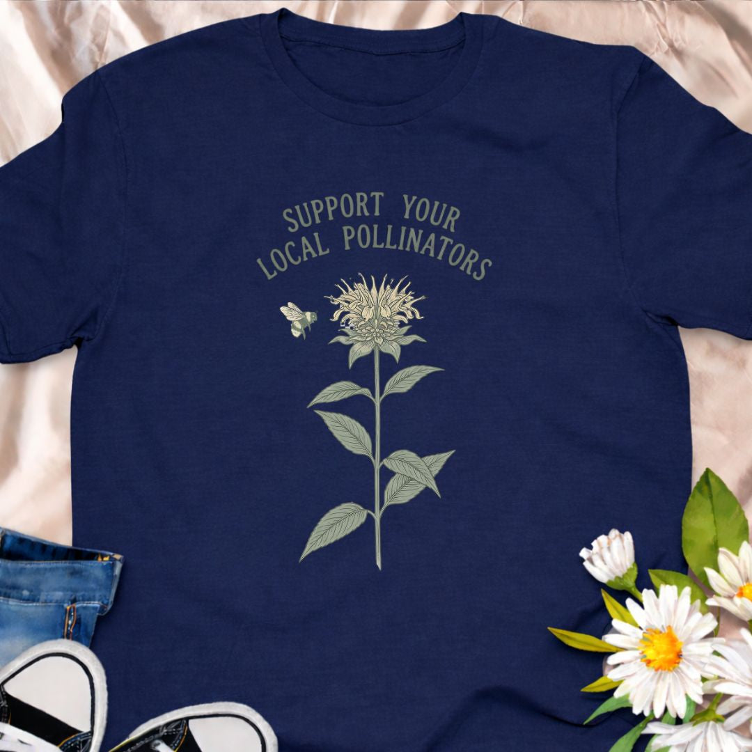 Show your love for bees and pollinator-friendly gardens with this “Support Your Local Pollinators” t-shirt. Featuring a botanical flower and bee illustration, this nature-inspired tee is perfect for gardeners, wildflower enthusiasts, and anyone passionate about helping pollinators thrive. A thoughtful gift for plant lovers and eco-conscious gardeners.