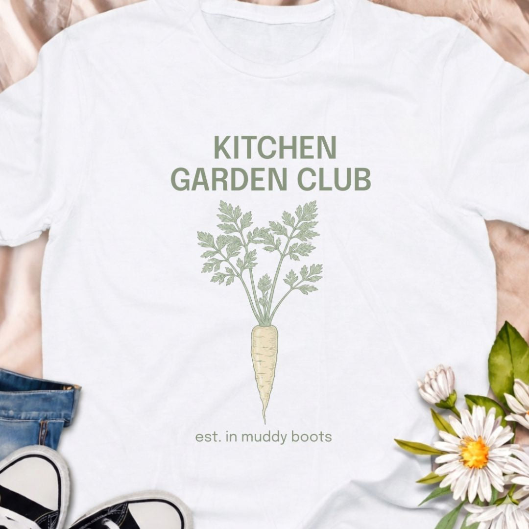 Join the Kitchen Garden Club with this botanical vegetable gardening t-shirt featuring a vintage carrot illustration and “est. in muddy boots.” Perfect for vegetable gardeners, homesteaders, and anyone who loves growing their own food. A thoughtful gift for gardeners, backyard growers, and kitchen garden enthusiasts.