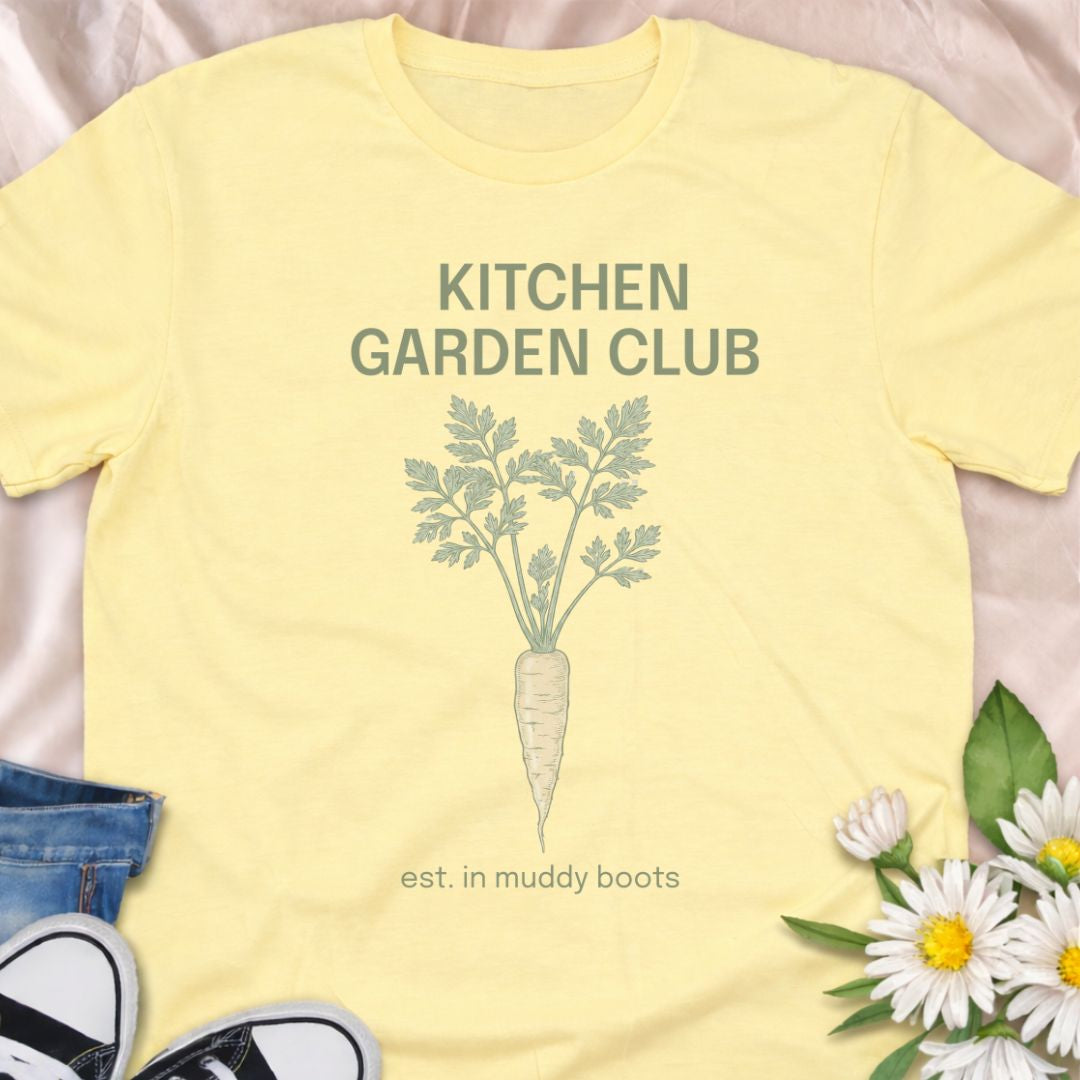 Join the Kitchen Garden Club with this botanical vegetable gardening t-shirt featuring a vintage carrot illustration and “est. in muddy boots.” Perfect for vegetable gardeners, homesteaders, and anyone who loves growing their own food. A thoughtful gift for gardeners, backyard growers, and kitchen garden enthusiasts.