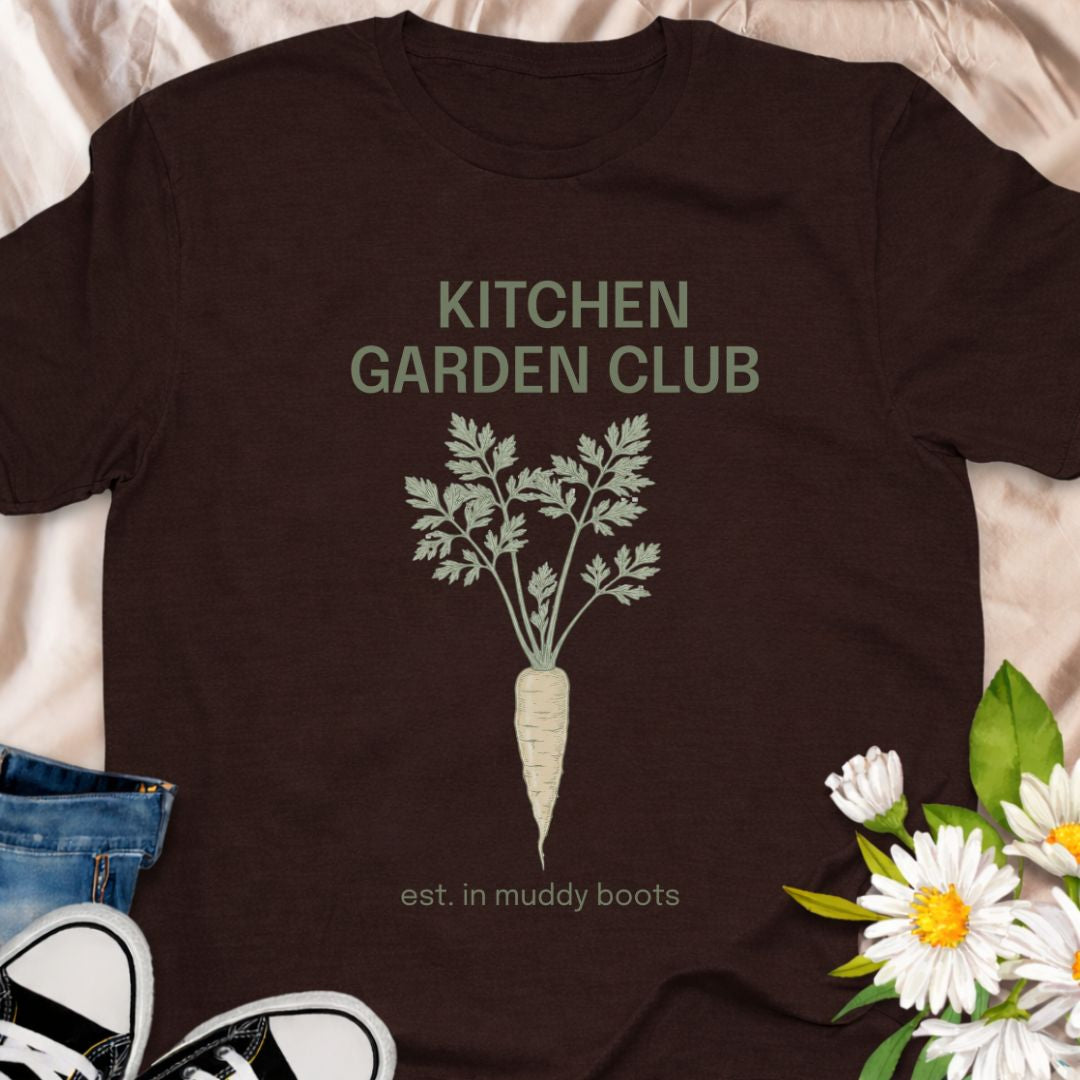 Join the Kitchen Garden Club with this botanical vegetable gardening t-shirt featuring a vintage carrot illustration and “est. in muddy boots.” Perfect for vegetable gardeners, homesteaders, and anyone who loves growing their own food. A thoughtful gift for gardeners, backyard growers, and kitchen garden enthusiasts.