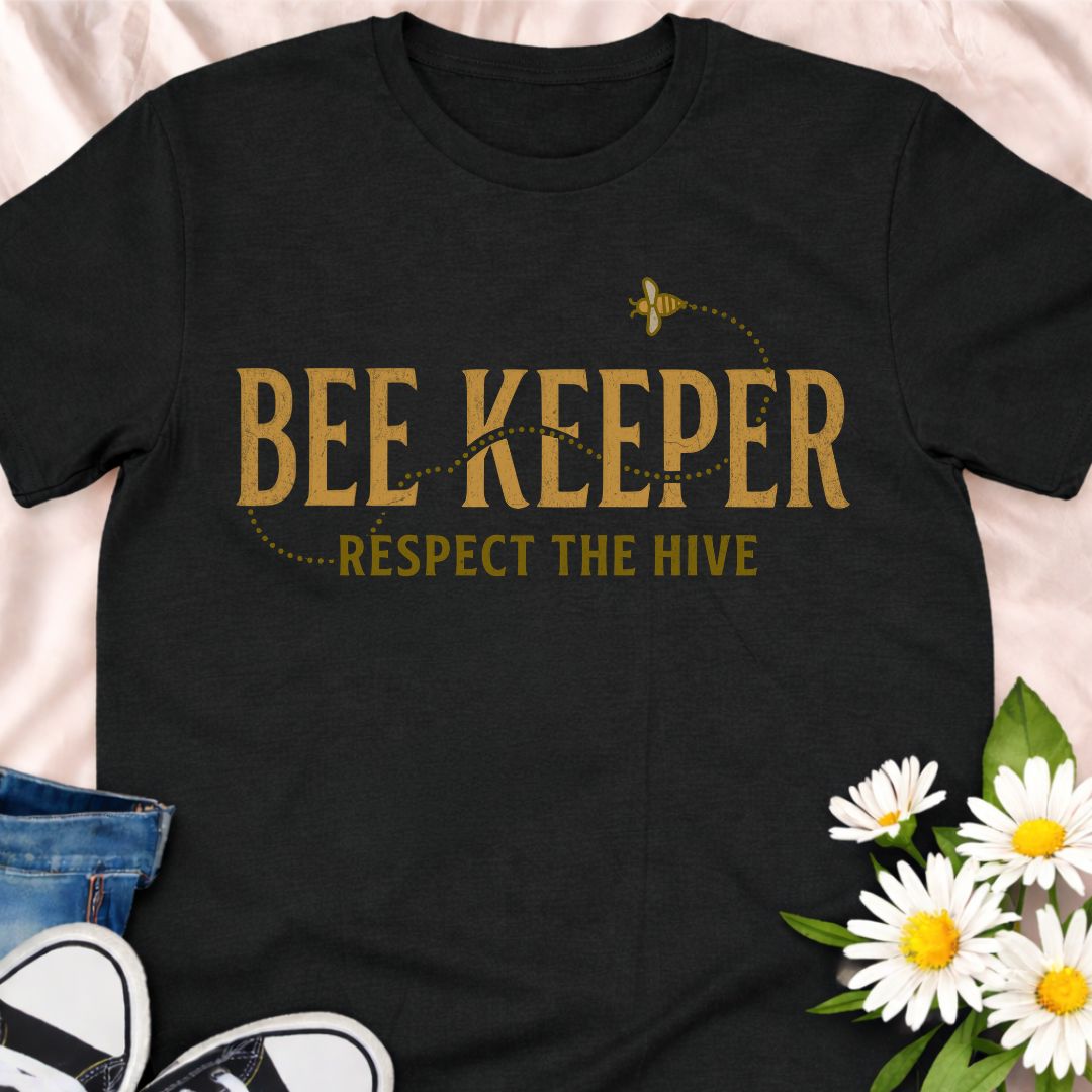 Show your passion for beekeeping with this “Bee Keeper – Respect the Hive” t-shirt. Perfect for beekeepers, pollinator supporters, and nature lovers who appreciate the vital role bees play in our ecosystems.
