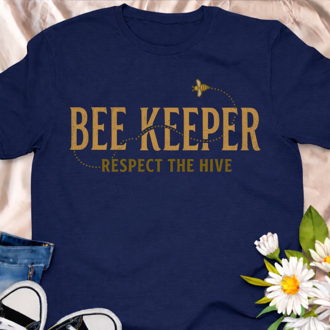 Show your passion for beekeeping with this “Bee Keeper – Respect the Hive” t-shirt. Perfect for beekeepers, pollinator supporters, and nature lovers who appreciate the vital role bees play in our ecosystems.