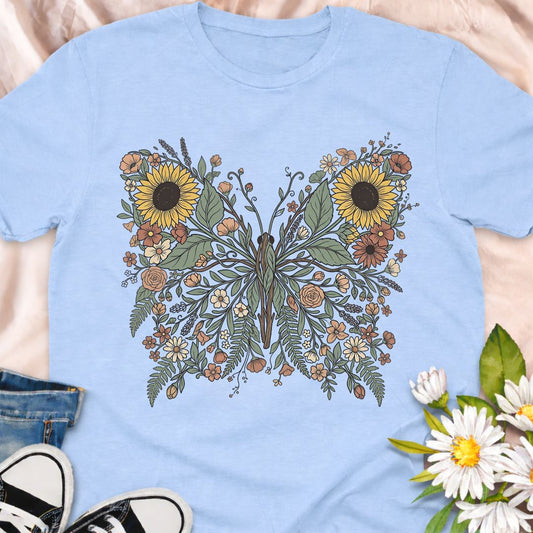 Beautiful botanical butterfly t-shirt featuring sunflowers, wildflowers, and delicate foliage forming an elegant butterfly design. Perfect for gardeners, nature lovers, pollinator supporters, and anyone who loves floral botanical art. 
