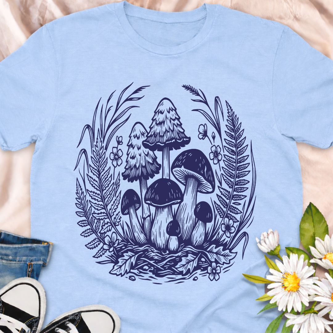 Beautiful woodland mushroom t-shirt featuring detailed forest fungi surrounded by ferns and wild plants in a botanical illustration style. Perfect for mushroom lovers, nature enthusiasts, gardeners, and fans of cottage core forest aesthetics.